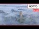 Stunning footage captures church spire piercing thick 'radiation fog' covering village | SWNS TV