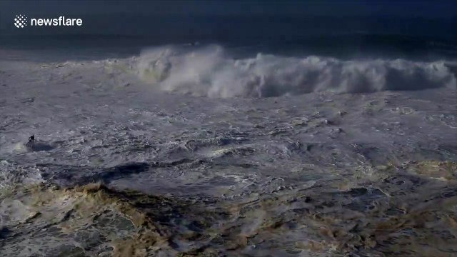 US surfer escapes terrifying wipe out in series of giant waves off Nazaré