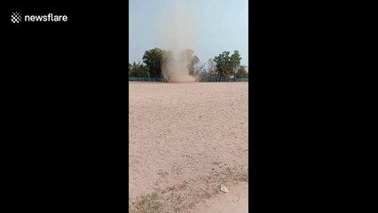 Children flee as mini tornado whips through school field in Thailand