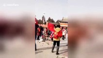 Chinese urban management officer violently smashes old vendor’s cart