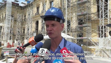 Workers recover items from Brazil's National Museum after fire