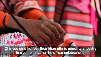 Girls sport their ancestors' hair for Lunar New year in China