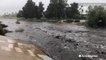 Debris, floodwaters overflowed river