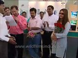Preity Zinta's dimpled laugh - signs autographs at Reliance Info launch, Karan Johar hangs around