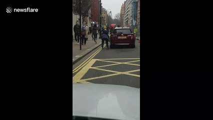 Rollerblading man gets free ride by hanging onto back of car