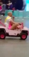 Trixie Mattel at DragCon in a mini car, no wig and flipping people off