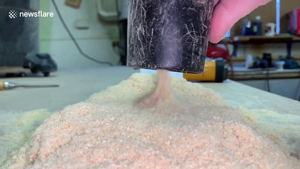 Oddly mesmerising footage sees sawdust sucked through vacuum