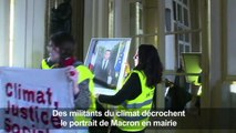 Climat: des activistes décrochent un portrait de Macron