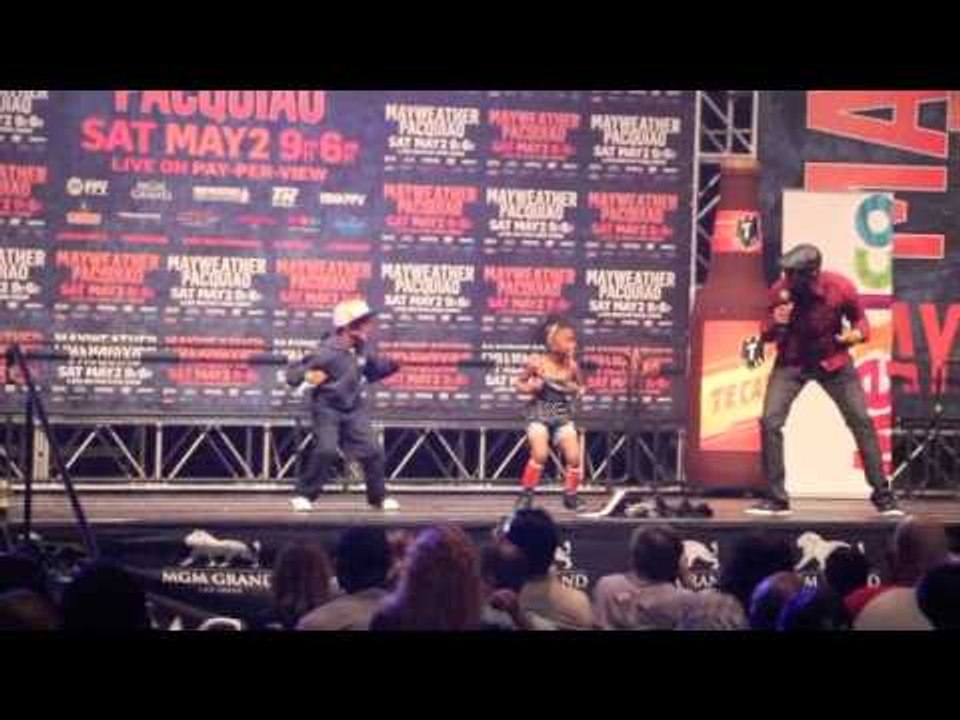 A COUPLE OF YOUNG HIPSTERS SHOW THEIR MOVES OFF ON MAYWEATHER'S GRAND ARRIVAL STAGE