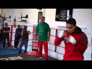 JOSE ZEPEDA SHADOW BOXING IN MANCHESTER UNDER THE WATCHFUL EYE OF TRAINER ROBERTY ALCAZAR