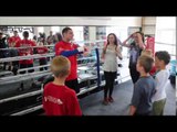 TOMMY COYLE ENTERTAINS THE KIDS OF HULL WITH A GAME OF 'HEADS & TAILS' & GIVES THE WINNERS TICKETS