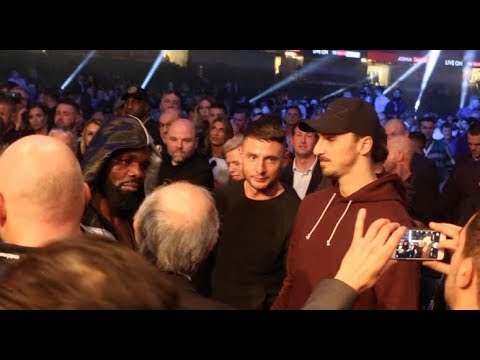 CARLOS TAKAM APPEARS TO BE CONSOLED BY ZLATAN IBRAHIMOVIC AFTER DEFEAT TO ANTHONY JOSHUA