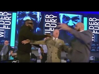DEONTAY WILDER SHOVES TYSON FURY AFTER BEING ASKED TO SPAR IN MIDDLE OF PRESS CONFERENCE