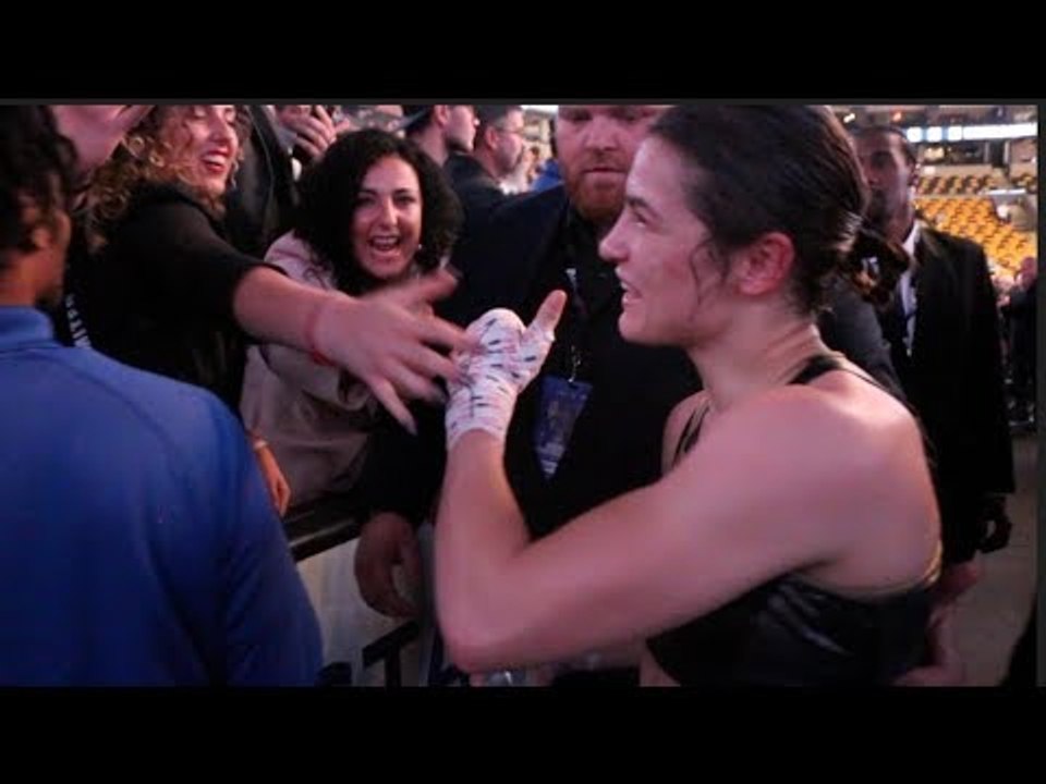 KATIE TAYLOR STRUGGLES TO GET BACK TO HER DRESSING ROOM - AS BOSTON FANS GET A LITTLE TOO EXCITED