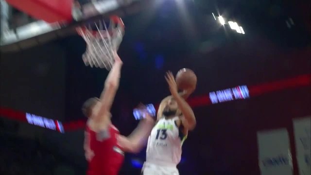Isaiah Hartenstein rises to block the shot