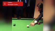 Theresa May plays pool with Giuseppe Conte