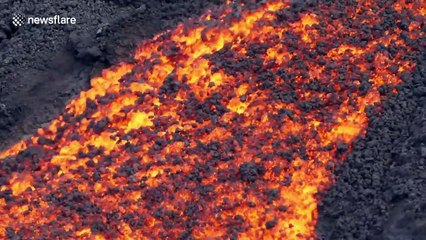 Brave hiker captures rivers of lava erupting from volcano on French-controlled island