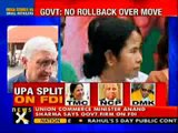 Govt defends FDI in retail, not to bow to Mamata