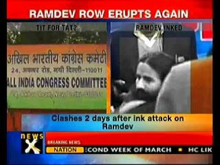 Ramdev supporters throw black ink on Sonia's poster