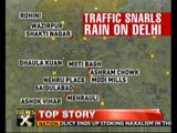 Heavy rain lashes Delhi, traffic disrupted - NewsX