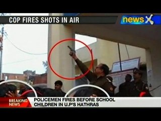 UP cop flaunts gun, fires in front of students