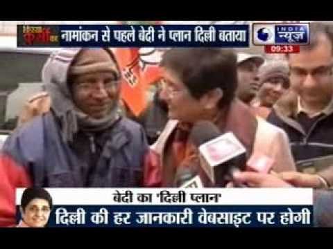 Kiran Bedi interacts with a tea vendor and a newspaper seller in Krishna Nagar