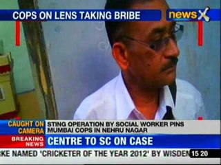 Caught on camera cops take bribe for illegal construction