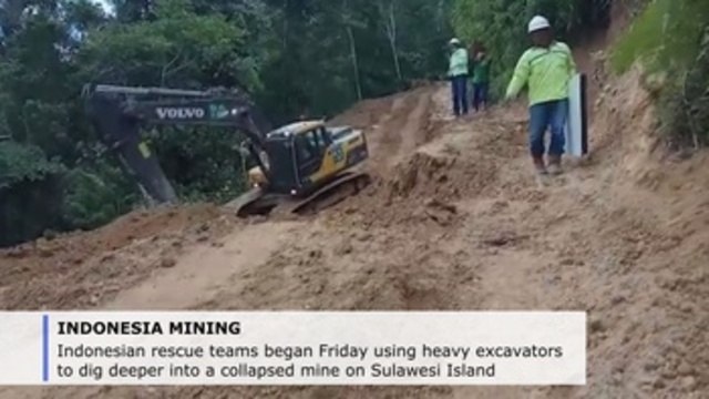 Indonesian rescuers use heavy excavators to free trapped miners