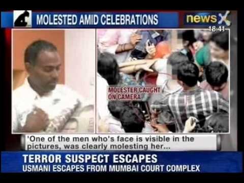 Molester caught on Camera: Picture shows men mingling with crowd and molesting woman