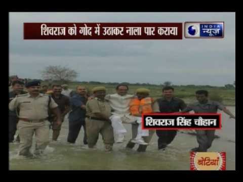 Madhya Pradesh CM Shivraj Singh Chouhan carried by cops during visit to flood-affected areas