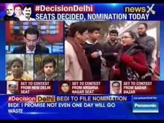 Kiran Bedi interacts with a tea vendor and a newspaper seller in Krishna Nagar