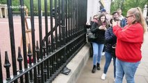 ‘It’s exciting!’ Tourists queue outside Buckingham Palace to glimpse royal baby easel