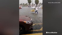 Entire parking lot underwater as storms flood Miami