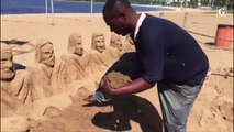 Santa Ceia artista cria escultura com areia na Praia de Camburi