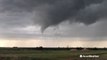 Tornado briefly touches down before drifting back into the clouds