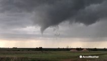 Tornado briefly touches down before drifting back into the clouds