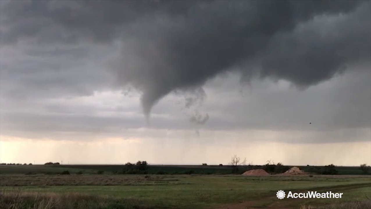 Tornado briefly touches down before drifting ba...