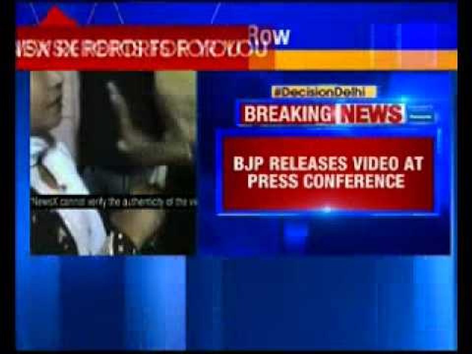 BJP releases a video depicting AAP distributing cash