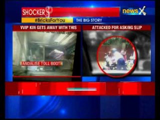 Delhi traffic policeman hits woman with brick