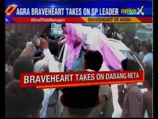 Woman smashes SP leader's car after his guard winked at her