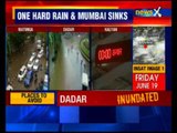 Heavy rain halts Mumbai, 2 killed; rail commuters hit hard