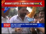 Sanitation workers burns Delhi CM Arvind Kejriwal's effigies