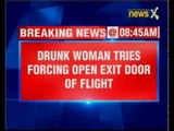 Drunk woman tries to force open the exit door of London-Boston flight