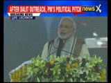 Prime Minister Narendra Modi interacts with rickshaw pullers, distributes e-rickshaws in Lucknow