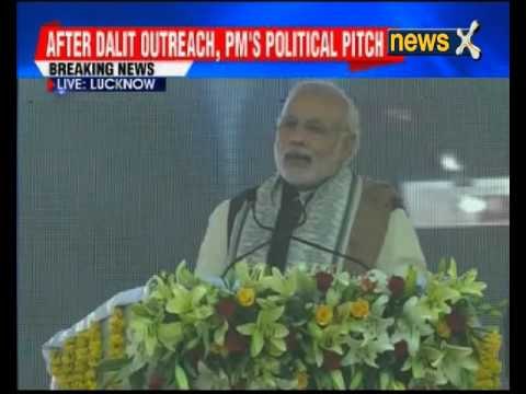 Prime Minister Narendra Modi interacts with rickshaw pullers, distributes e-rickshaws in Lucknow