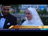 رأي عام - عريس وعروسة مصريان يحتفلان بزفافهما في ملعب مباراة مصر والسعودية