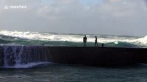 Daredevil youths plunge into rough waters as Storm Freya pounds UK