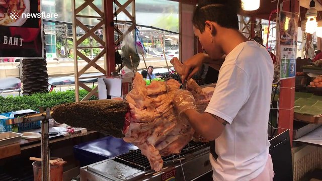 Crikey! Grilled crocodile on display in Thai shopping mall