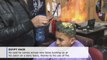 Egyptian barber uses fire to coif hair, wins clients over with affordability