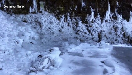 Freezing weather turns Portland waterfall into enchanting icy grotto